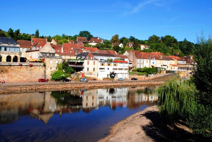 River Vezere in the market town of Le Bugue, France